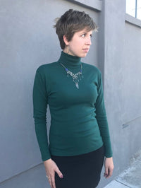 Rachel in the medium turtleneck (forest green - previous season)